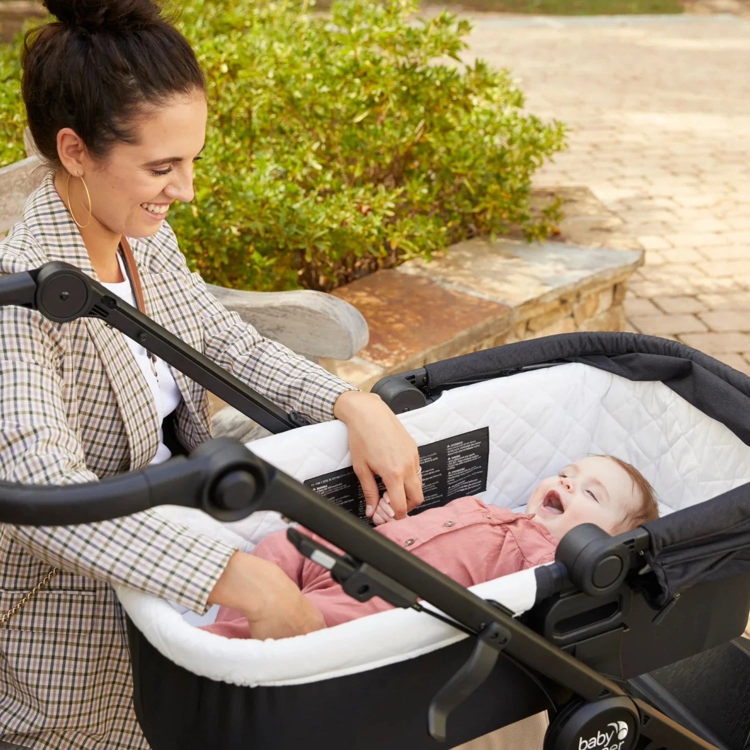 baby in basinet on stroller