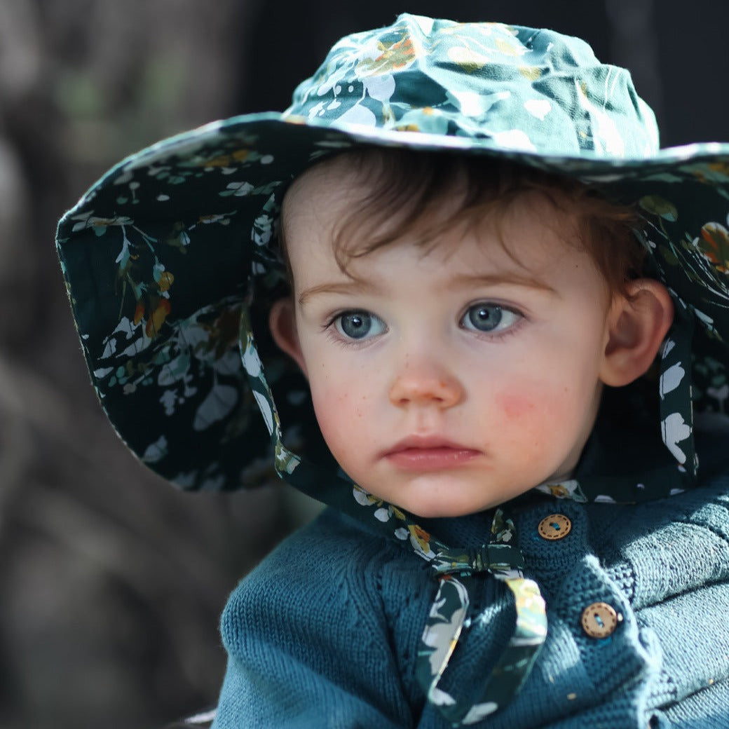 toddler wearing wide brim organic sun hat